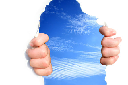 Hands on the sky tear a hole