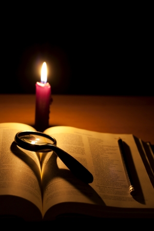Bible and magnifier searching of godの写真素材