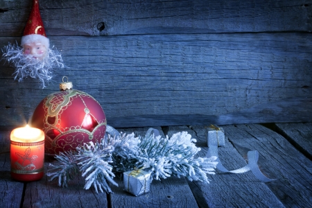 Christmas vintage background with candle and bauble in nightの写真素材
