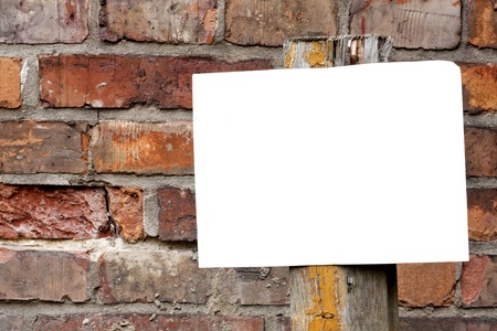 Empty blank plate on brick wallの写真素材