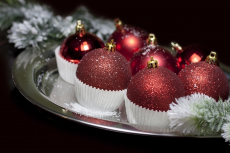 Christmas baubles in cup cupcakes food conceptの写真素材