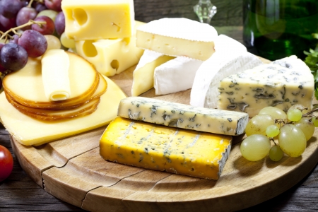 Cheese and wine various assortment vintage still life の写真素材
