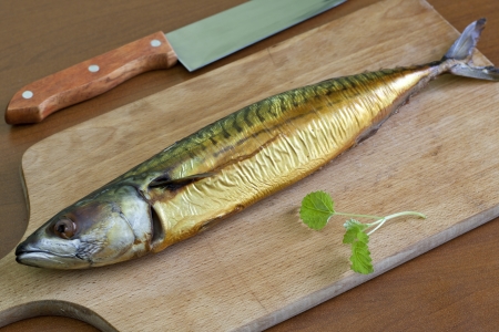 Smoked mackerel on the tableの写真素材