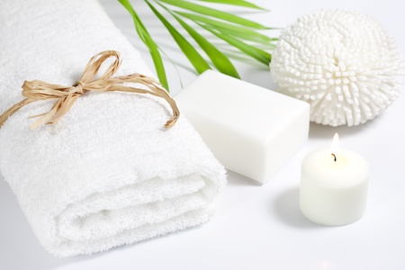Towel and sponge spa bath concept on white backgroundの写真素材