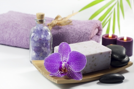Spa soap with towel and orchids on white backgroundの写真素材