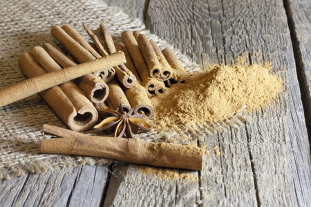 Cinnamon sticks and meal on wooden boards