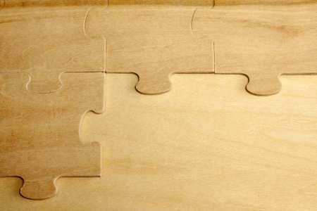 Puzzle on wooden boards abstract background conceptの写真素材