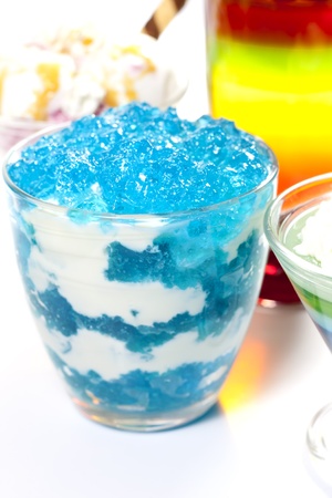 Dessert blue jelly in bowl with whipped creamの写真素材