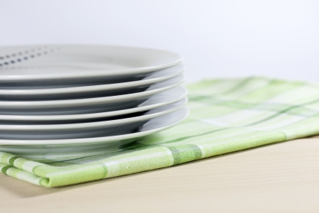 Plates on tablecloth in kitchen abstract food backgroundの写真素材
