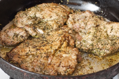 Grilled pork steak meat with herbs and spicesの写真素材