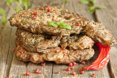 Grilled pork steak meat with herbs and spicesの写真素材