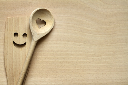 Wooden kitchenware on cutting board abstract food backgroundの写真素材