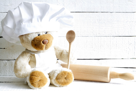 Teddy bear in chef hat with spoon abstract food の写真素材