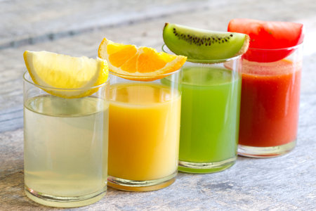 Fresh juice in glass with slices of fruits and vegetables