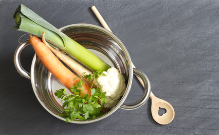 Raw vegetables pot and spoon love cooking conceptの写真素材