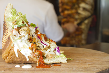 Kebab grilled meat in bread in restaurantの写真素材