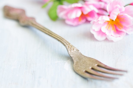 Spring abstract background food concept with fork and cherry blossomの写真素材
