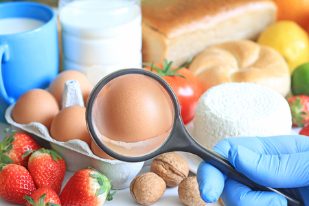 Allergy food abstract concept with examining doctor and magnifier Allergy food abstract concept with examining doctor and magnifier