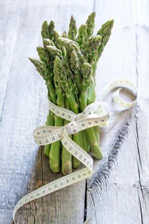 Asparagus and centimeter healthy lifestyle and diet abstract conceptの写真素材