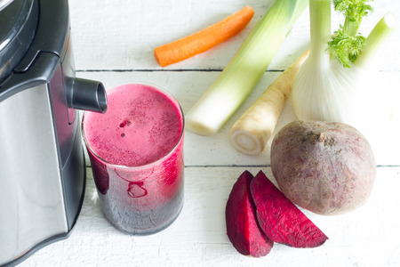 Juicer, red beetroot juice, other vegetables health diet detoxification conceptの写真素材