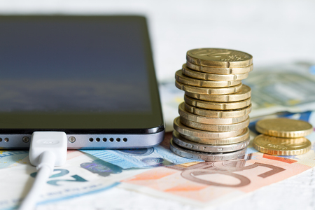 Phone and money euro with coins conceptの写真素材