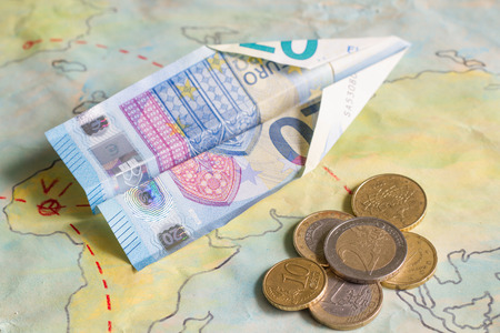 Low cost airlines with plane and euro money conceptの写真素材