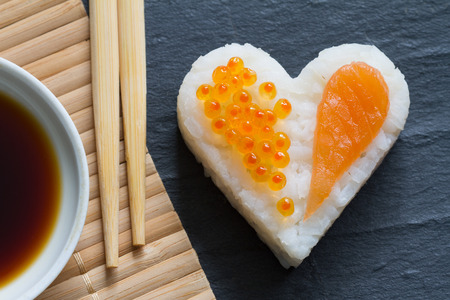 Sushi heart macro seafood concept with salmon and caviarの写真素材