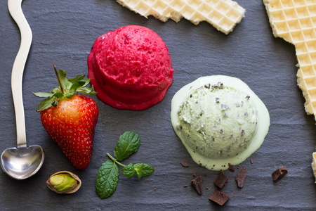 Strawberry mint abstract melting ice cream on black marble concept still lifeの写真素材