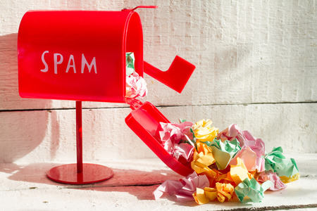 Full red mailbox of spam problem abstract on white backgroundの写真素材