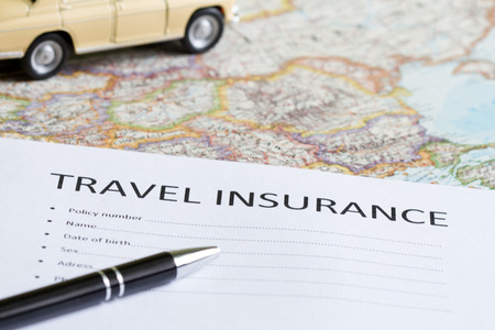 Travel insurance concept with car and mapの写真素材