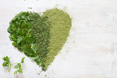 Green vegetables and herbs in heart health conceptの写真素材