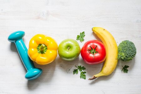 Healthy diet and sport concept with fruits and vegetablesの写真素材