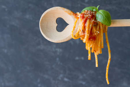 Spaghetti on spoon with heartの写真素材