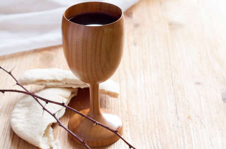 Chalice of wine, passover bread, thorns as Jesus Last Supper and Passion of Christ conceptの写真素材