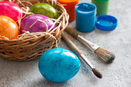 Hand painted easter eggs, paints and brushes