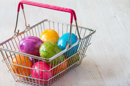 Commercial concept with easter eggs in shopping basketの写真素材