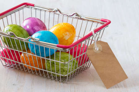 Commercial concept with easter eggs in shopping basketの写真素材