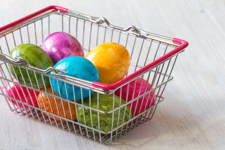 Commercial concept with easter eggs in shopping basketの写真素材