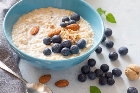 Oatmeal with fresh berries and nutsの写真素材