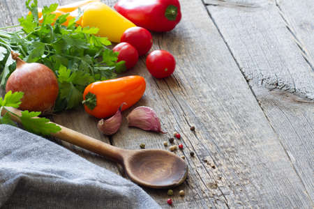 Wooden spoon and ingredients food on old boards backgroundの写真素材
