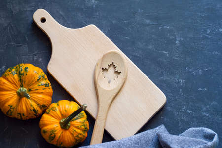 Food background with spoon and pumpkin, autumn cooking conceptの写真素材