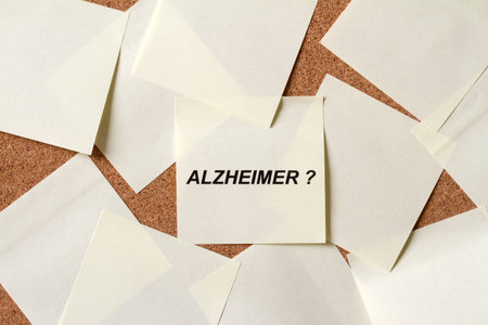 Sticky notes with word alzheimer on board, alzheimer's disease concept