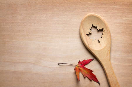 Food background with spoon and leaf, autumn cooking conceptの写真素材