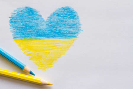 Drawn blue-yellow heart and crayons, symbol of unity with Ukraineの写真素材
