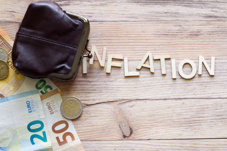 Coin purse with money and text Inflation, conceptの写真素材