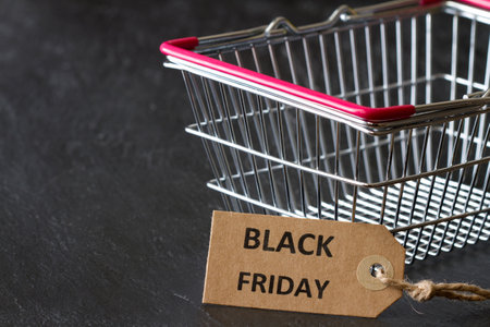 Shopping basket with tag, black friday sale and discount conceptの写真素材