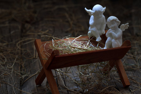 Manger of Jesus with angels, abstract christmas nativity scene conceptの写真素材