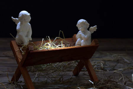 Manger of Jesus with angels, abstract christmas nativity scene conceptの写真素材