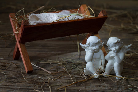 Manger of Jesus with angels, abstract christmas nativity scene conceptの写真素材