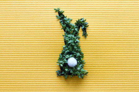 Easter bunny made with cress on yellow background, conceptの写真素材